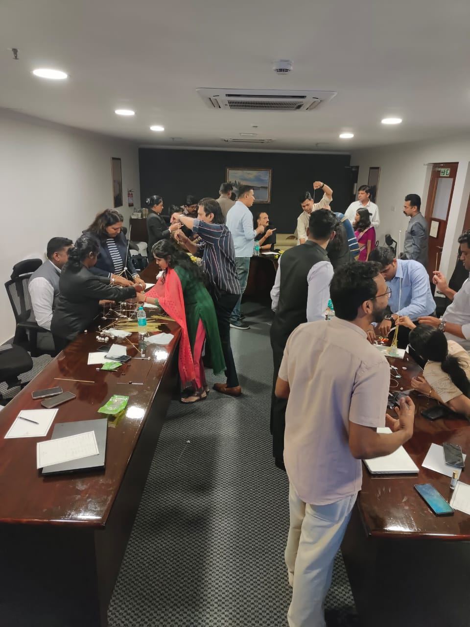 Workshop participants building a structure together
